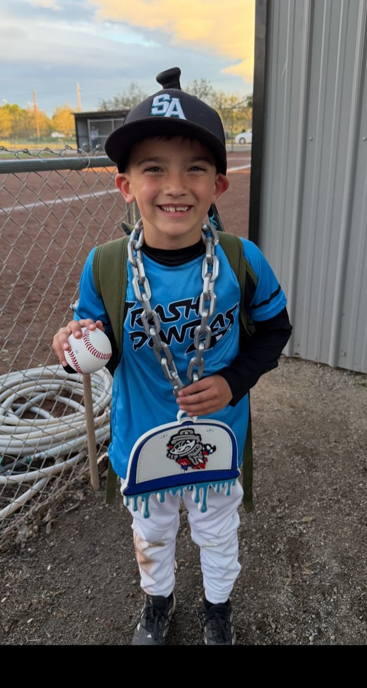 Youth baseball player at the field wearing a custom team hype chain